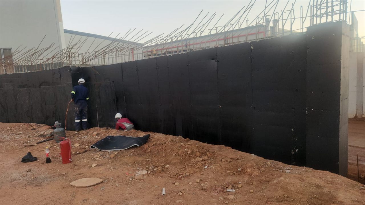 Structural waterproofing on a retaining wall